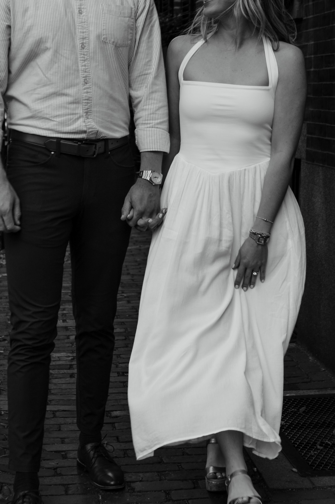 Couple holding hands on a Beacon Hill street during their Boston engagement session